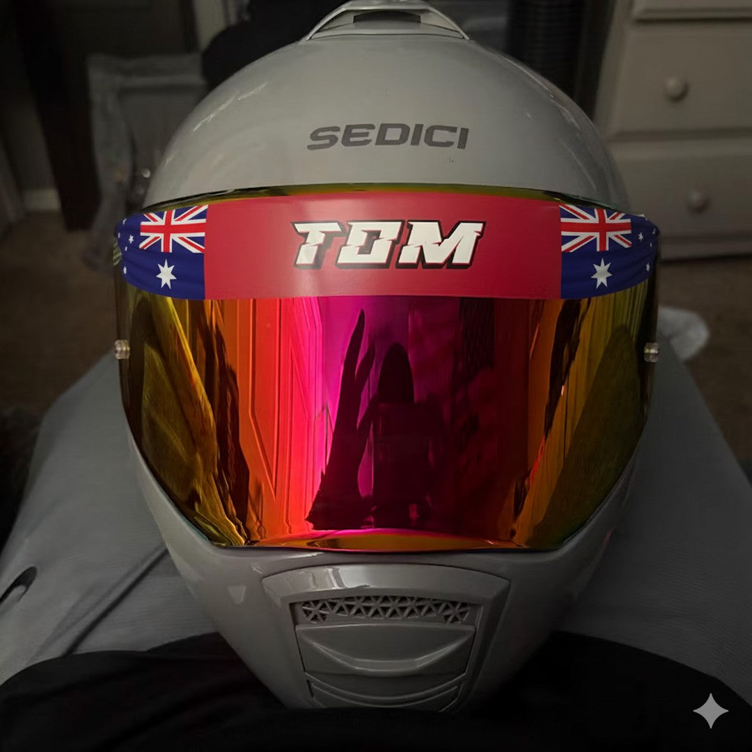 Visor sunstrip decal – Australian flag strip with the name TOM across a mirrored helmet visor