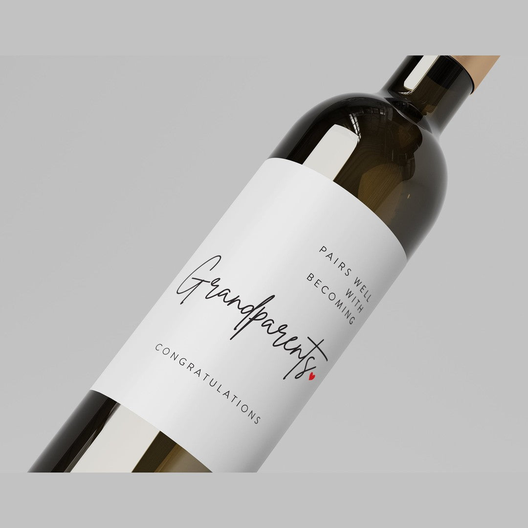 Wine label – white label on a dark bottle reading Pairs well with becoming Grandparents, Congratulations, small red heart