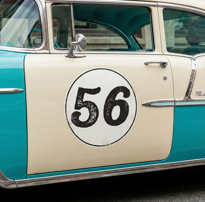 Distressed font race number roundel decal on a classic car door