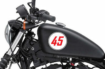 Outlined race number roundel decal on a motorcycle tank