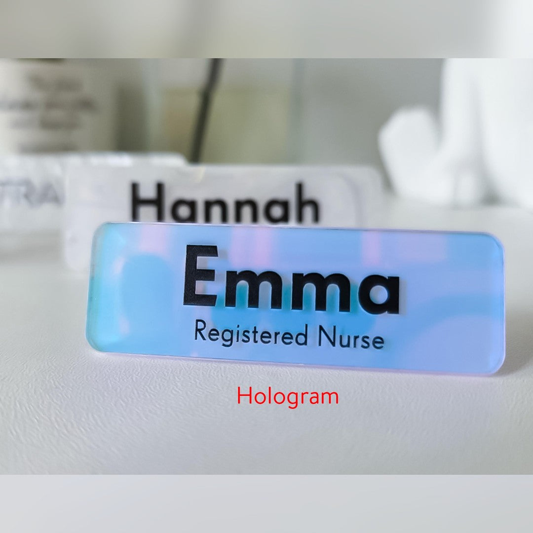 Holographic acrylic name badge – pale blue and pink colour-shift badge reading Emma, Registered Nurse in black