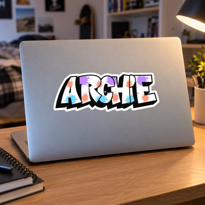 Graffiti name sticker – paint splatter design on a laptop lid